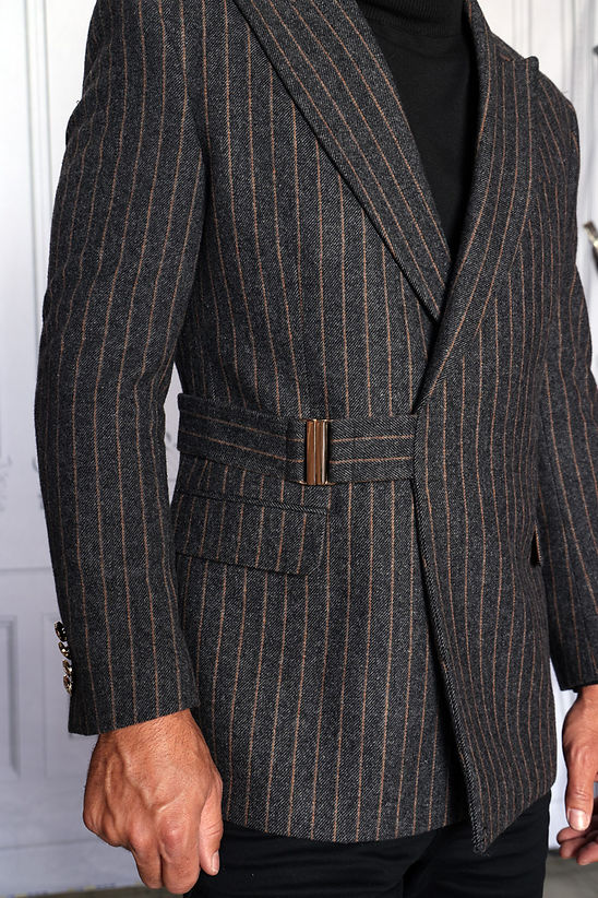 A man wearing the Manzini MANZINI MZW-702 Men's Pinstripe Blazer Coat w/ Hook Belt in charcoal over a black turtleneck, shown from the shoulders up against a light background.