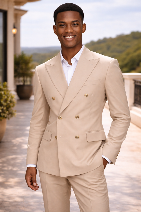 A man smiles at the camera outdoors, wearing the Manzini IMPRESS Men's 2PC Spandex Double Breast Slim-Fit Suit in tan and a white shirt, with greenery and a building behind him.