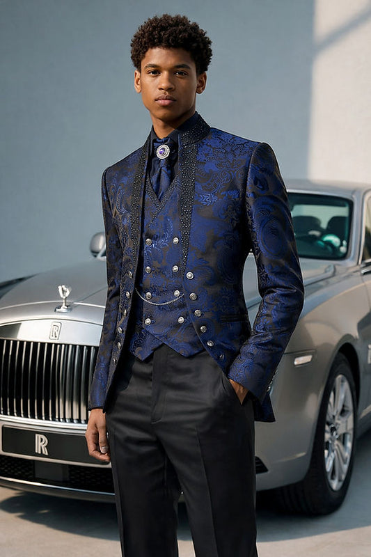 A young man in a Manzini MANZINI LANZINI 3-Piece Slim-Fit Baroque Gothic Tuxedo Prom Wedding Suit with rhinestones in navy stands before a silver Rolls-Royce, his hands in his pockets.
