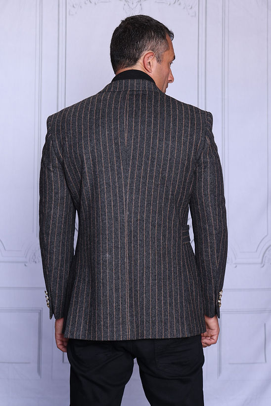 A man wearing the Manzini MANZINI MZW-702 Men's Pinstripe Blazer Coat w/ Hook Belt in charcoal over a black turtleneck, shown from the shoulders up against a light background.