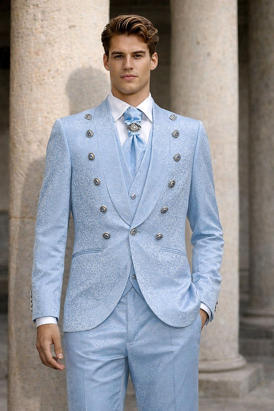 A man in a Manzini MIDLAND 3-Piece Slim-Fit Vintage Tuxedo Prom Wedding Suit with satin trim in Sky stands in front of stone columns.