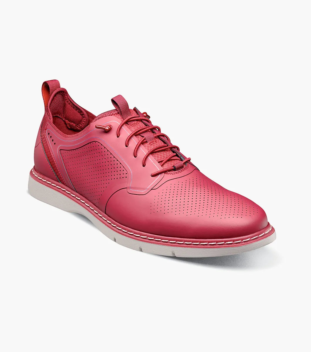 The Stacy Adams Synchro Plain Toe Elastic Lace Up sneaker in Raspberry features perforated detailing, anatomical arch support, and a white sole—shown as a single shoe on a plain white background.