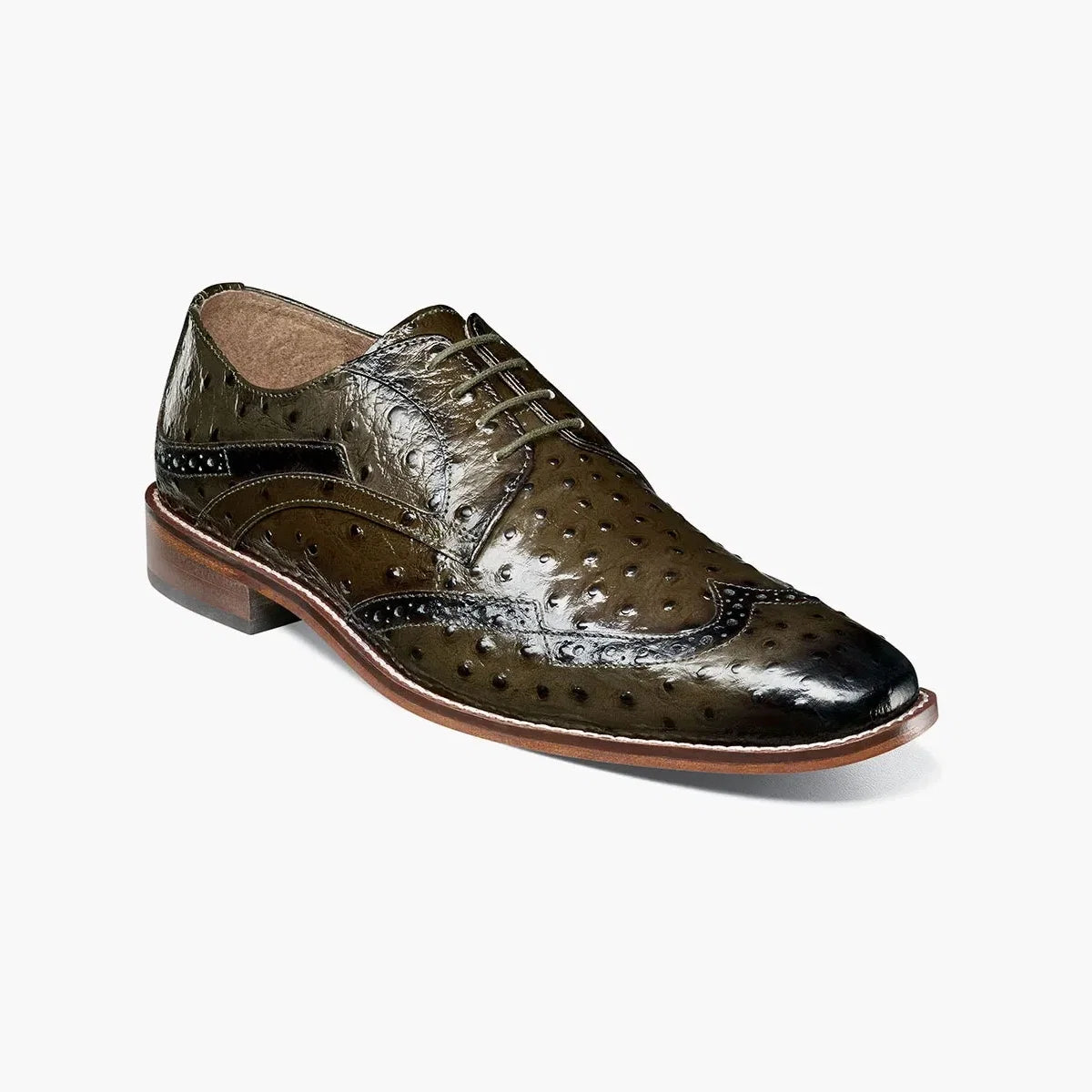 The Stacy Adams Gennaro Wingtip Oxford in olive features classic brogue detailing, a lace-up closure, and a distinctive design, available on final clearance in sizes 7.5 and 11 only.