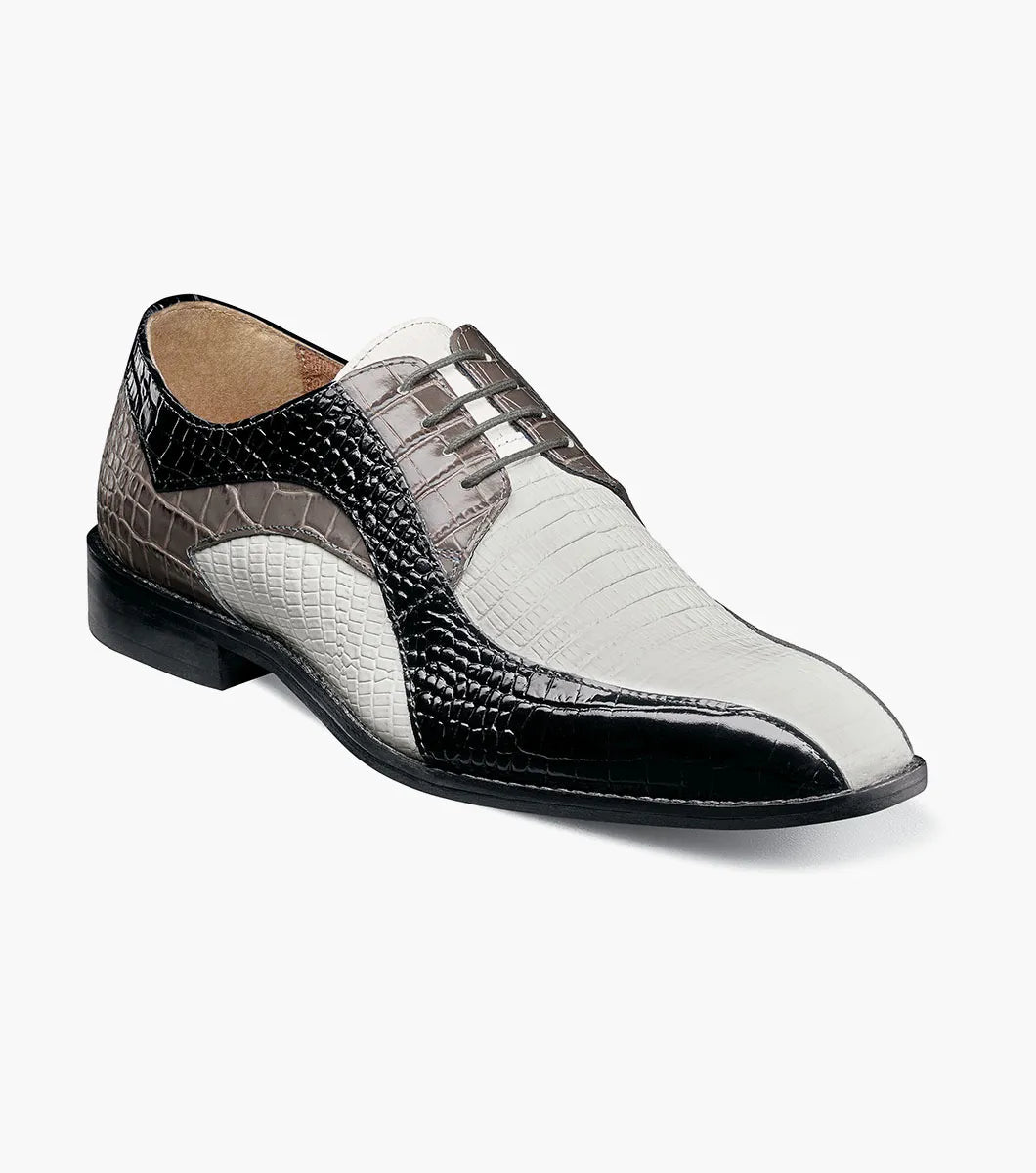 The Stacy Adams Turano Bike Toe Oxford (25576-910) is a men's dress shoe in black and grey croco print leather with white accents, featuring a low heel and lace-up closure.