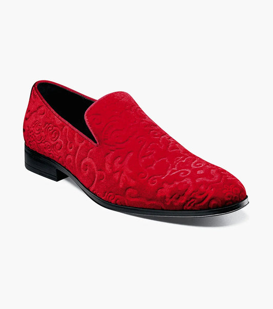 The Stacy Adams Saunders Debossed Velour Slip On in red (25581-600) features swirling embossed patterns, a black sole, and a cushioned insole for comfort.