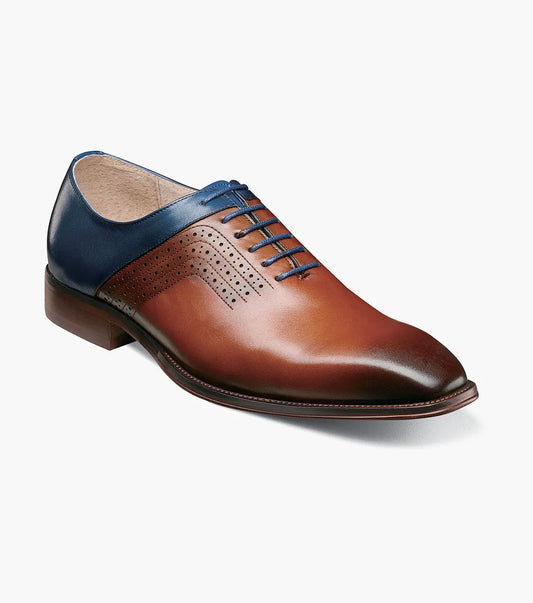 The Stacy Adams Halloway Plain Toe Oxford in Cognac Multi (25585-229) features leather construction with closed lacing and decorative perforations, showcased against a white background.