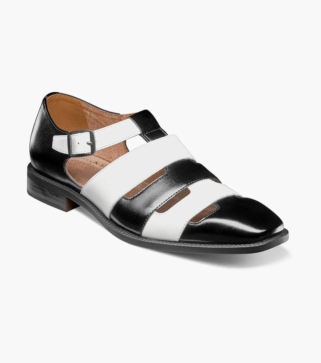 The Stacy Adams Calderon Closed Toe City Sandal (25599-111) features black and white leather, a side buckle, multiple cutout straps, cushioned insole, closed toe, and low heel for comfort and style.