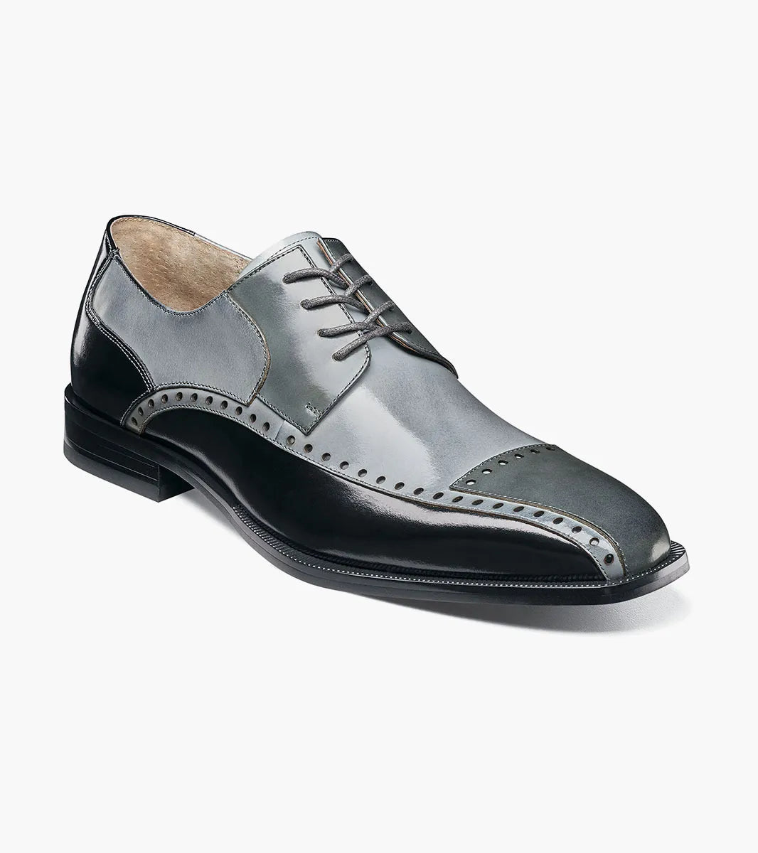 The STACY ADAMS Plaza Modified Cap Toe Oxford in Black/Gray (25608-975) features laces, decorative perforations, and a stylish stacked heel. Shown in profile against a white background.
