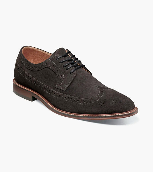 The Stacy Adams Marligan Wingtip Oxford in dark gray features brogue detailing, black laces, and a low stacked heel, displayed on a plain white background. Brand: STACY ADAMS. Style: 25616-011.