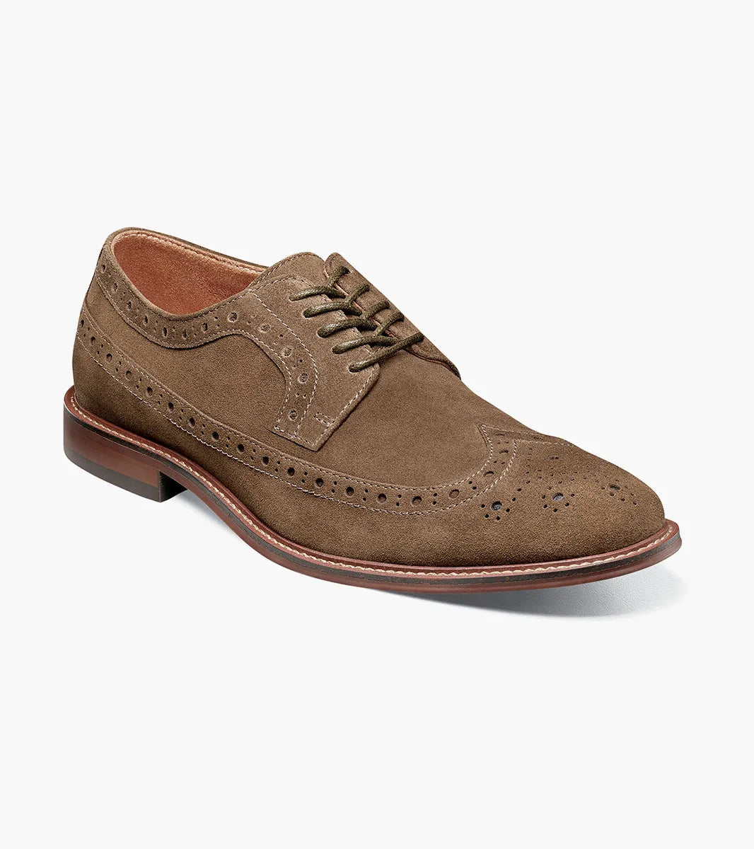 The Stacy Adams Marligan Wingtip Oxford - Mocha (25616-216) is a men's brown suede leather dress shoe featuring decorative perforations, brown laces, and a low stacked heel displayed on a white background.