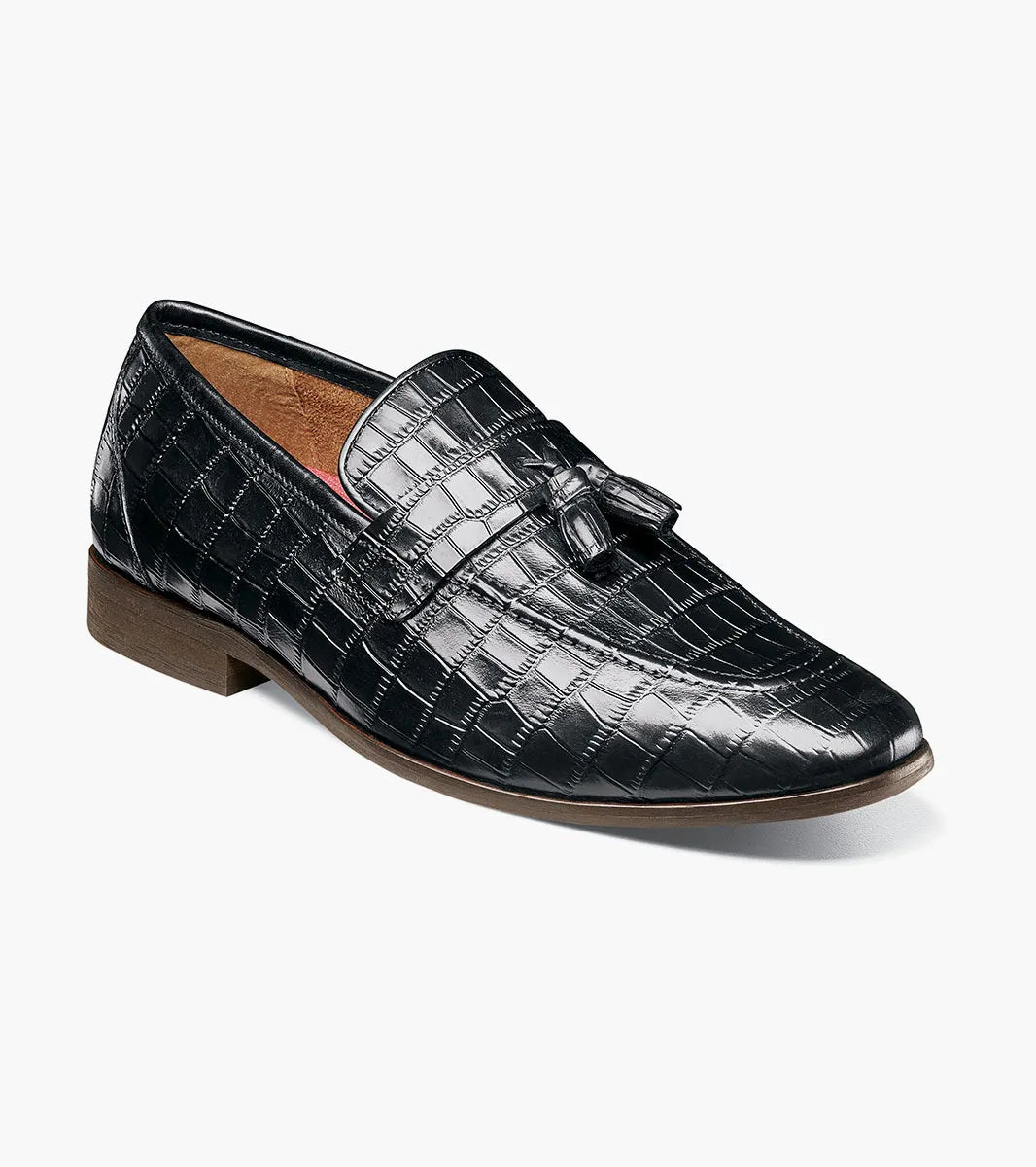 STACY ADAMS Franz Moc Toe Tassel Slip On loafer in black crocodile print leather features a slip-on design with tassel detail, a RedZone footbed for enhanced comfort, and a low brown heel. Shown on a plain white background.