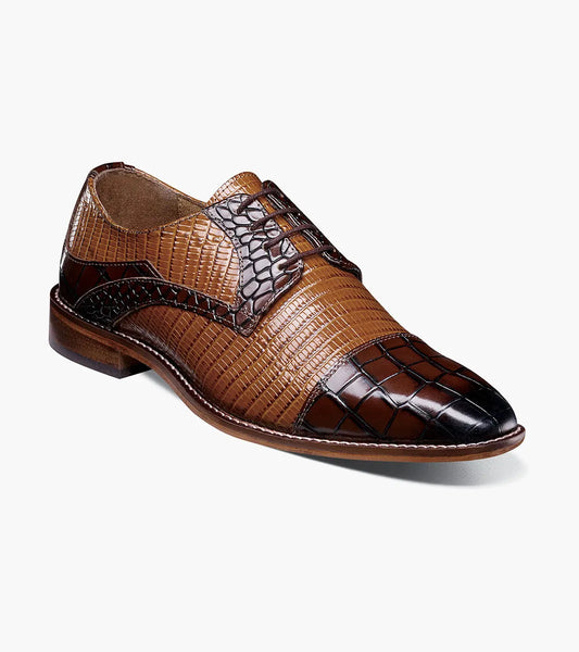 The Stacy Adams Tedesco Cap Toe Oxford in Brown Multi (25630-249) features a crocodile print pattern on the toe, sides, and vamp, set against a plain white background.