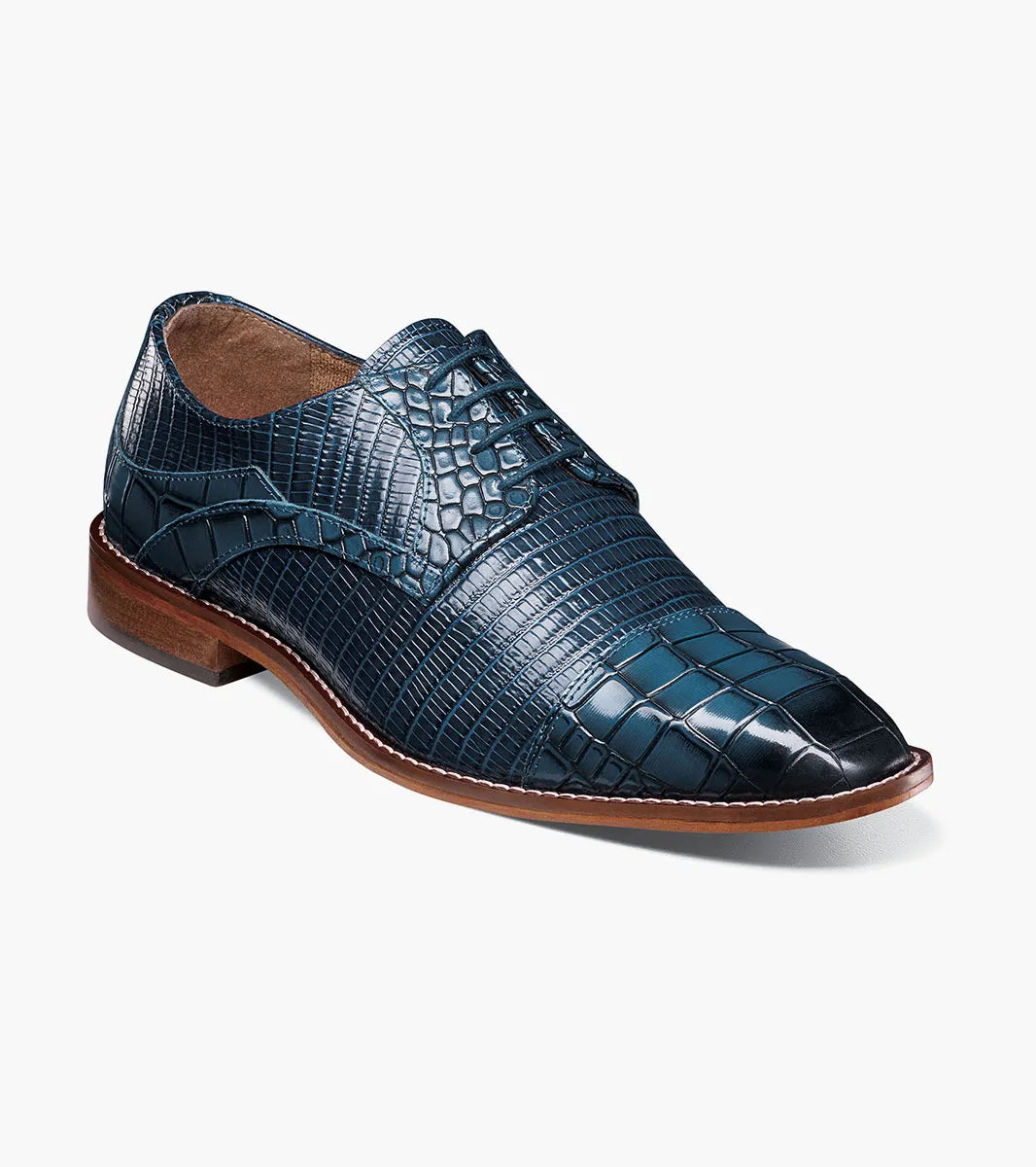 The Stacy Adams Tedesco Cap Toe Oxford (25630-400) is a blue crocodile print leather dress shoe with a RedZone footbed, brown sole, and laces shown on a white background.