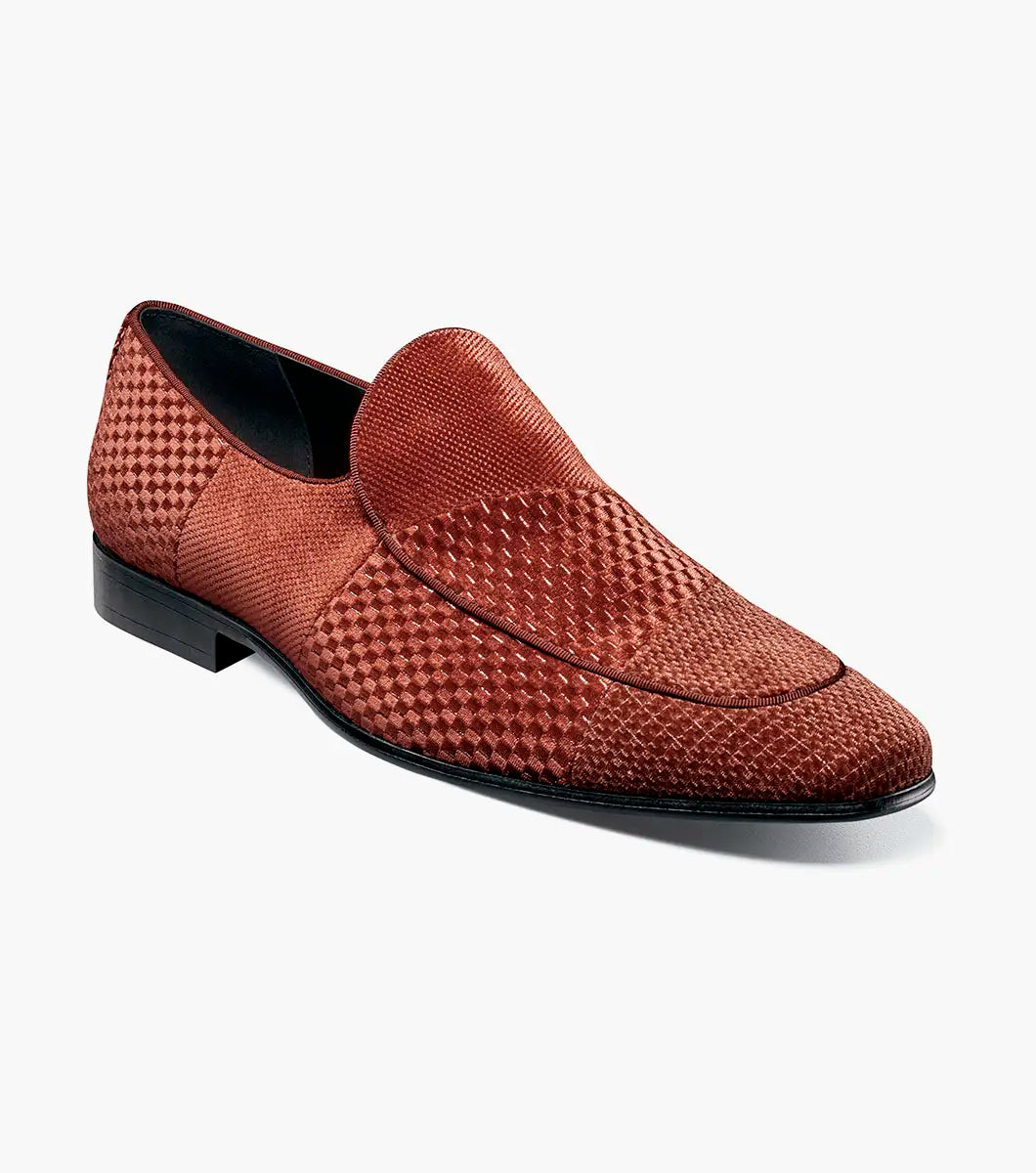 The STACY ADAMS Shapshaw Velour Moc Toe Slip On in Cognac (25642-221) features brown textured leather, a cushioned insole, and a low black heel, displayed against a plain white background.