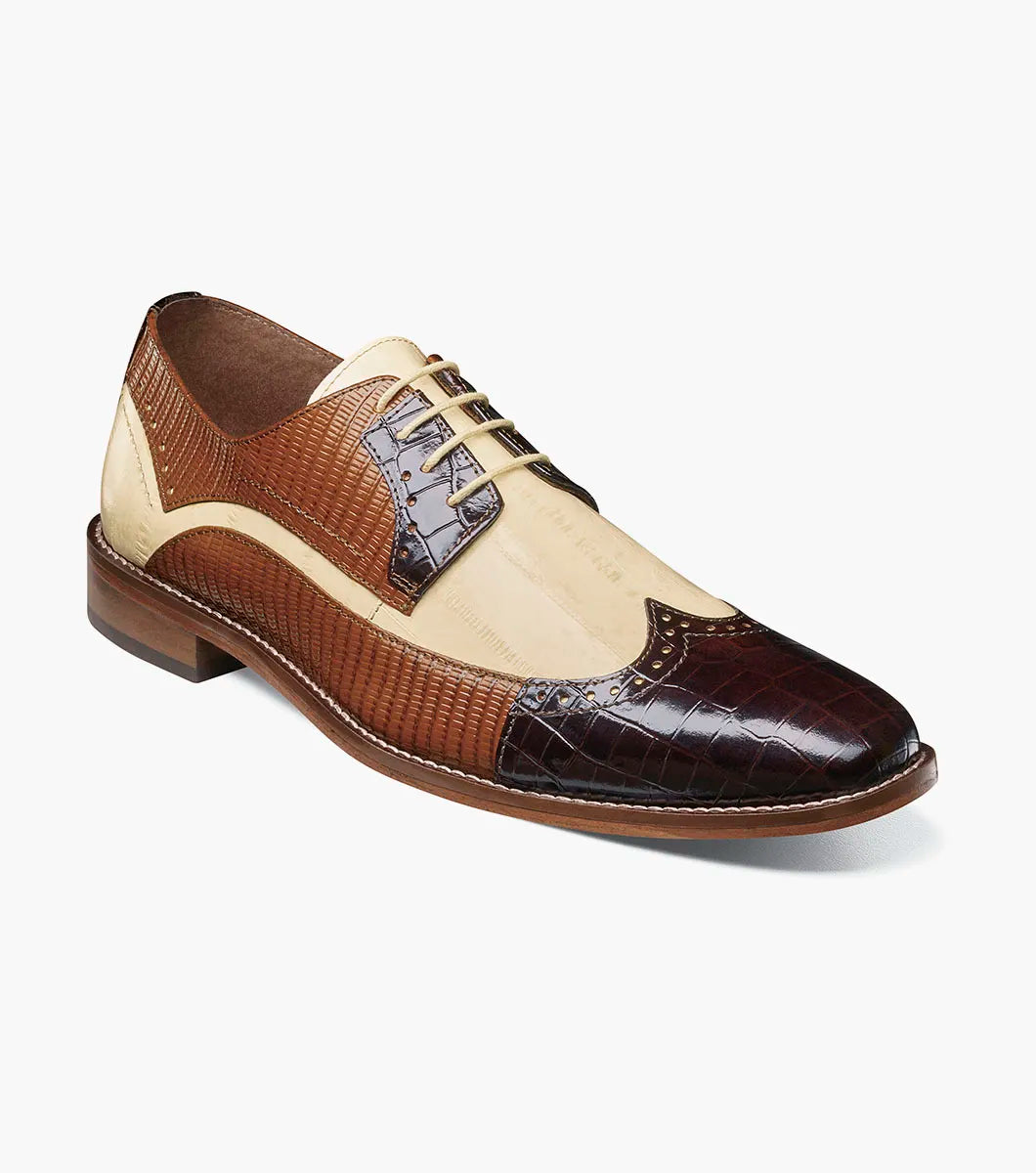 The STACY ADAMS Gallinari Wingtip Lace Up (Brown Multi, 25660-249) is a men's two-tone dress shoe with brown crocodile-textured leather, beige panels, cushioned footbed, lace-up design, and low heel.