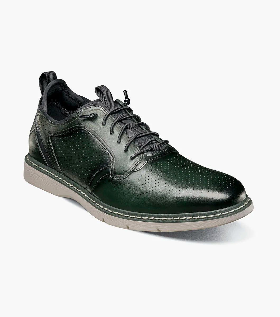 The STACY ADAMS Sync Plain Toe Elastic Lace Up in green (25662-300) features dark green leather, perforated detailing, black elastic laces, a RedZone footbed, and a light gray sole, shown on a white background.