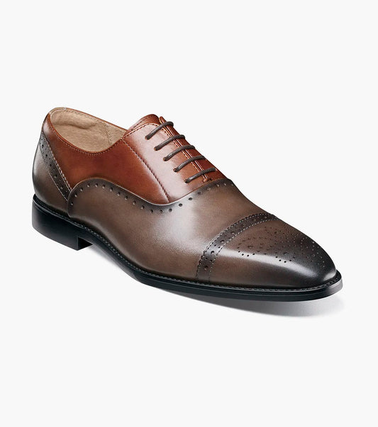 The STACY ADAMS Reynolds Cap Toe Oxford in Gray Multi (25670-062) features decorative perforations and a Memory Foam insole, shown angled on a white background.