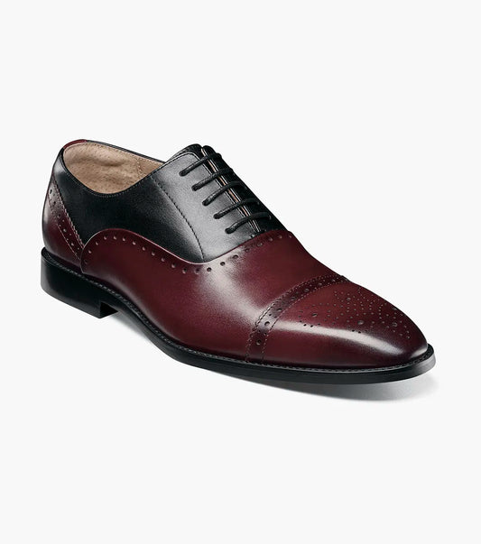 The STACY ADAMS Reynolds Cap Toe Oxford in Burgundy Multi features a black and burgundy leather upper, memory foam cushioning, decorative perforations, and a classic cap toe.