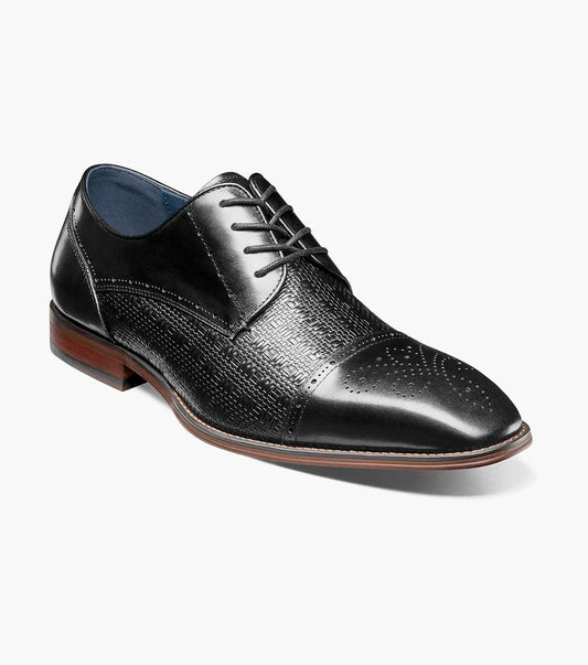 The Stacy Adams Silsbury Cap Toe Oxford in black features a leather upper with textured pattern, wooden heel, elegant perforated detailing, and a Memory Foam footbed for comfort. Style code: 25675-001.