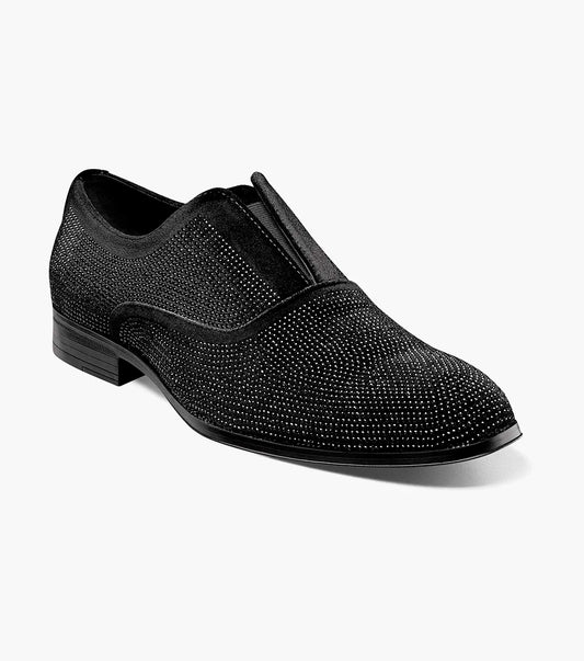 The Stacy Adams Starleigh Rhinestone Plain Toe Slip On (Black, 25685-001) is a men's black slip-on dress shoe with a low heel, rounded toe, cushioned footbed, and small silver rhinestones across the upper.