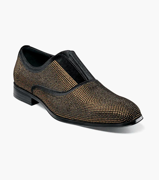 The STACY ADAMS Starleigh Rhinestone Plain Toe Slip On (25685-715) is a men's black and gold dress shoe with a low heel, featuring small gold studs on the velour textile upper.