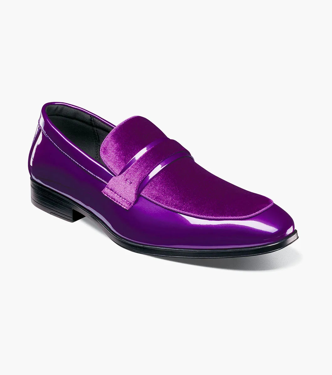 A single STACY ADAMS Spratley Moc Toe Saddle Slip On in purple (style 25686-542) is displayed against a plain white background, showcasing its shiny velour upper, low black heel, and comfortable memory foam insole.