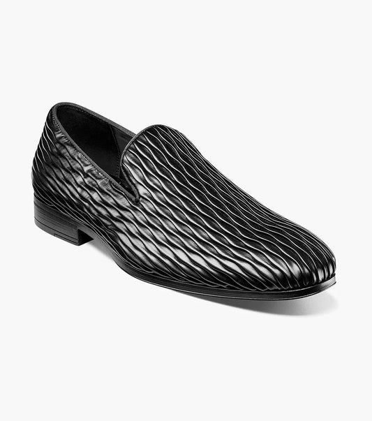 The Stacy Adams Seismith Plain Toe Slip On in black (style 25688-001) features a textured wavy pattern and a Memory Foam footbed, shown against a white background.