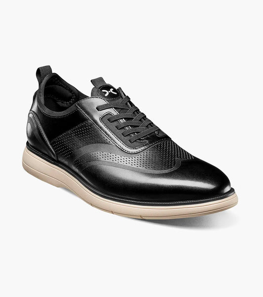 The Stacy Adams Edgewood Wingtip Elastic Lace Up in Black features perforated detailing, anatomical arch support, and a light beige sole. This STACY ADAMS dress shoe combines classic style with athletic comfort.