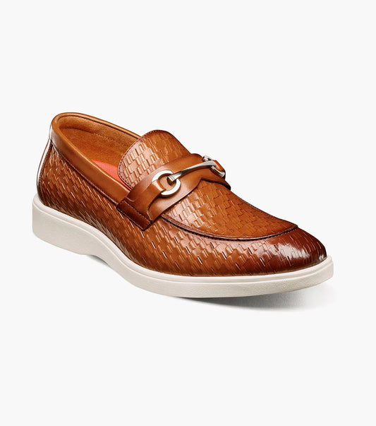 The Stacy Adams Salyer Moc Toe Bit Slip On in tan features printed leather, a silver bit detail, anatomical arch support, and a white rubber sole by STACY ADAMS, shown on a plain white background.