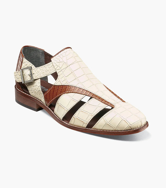 The Stacy Adams Calandro City Sandal in Ivory Multi (25695-114) features crocodile print leather, cream and brown color, closed toe, side buckle, cut-out details, cushioned footbed, and low heel.