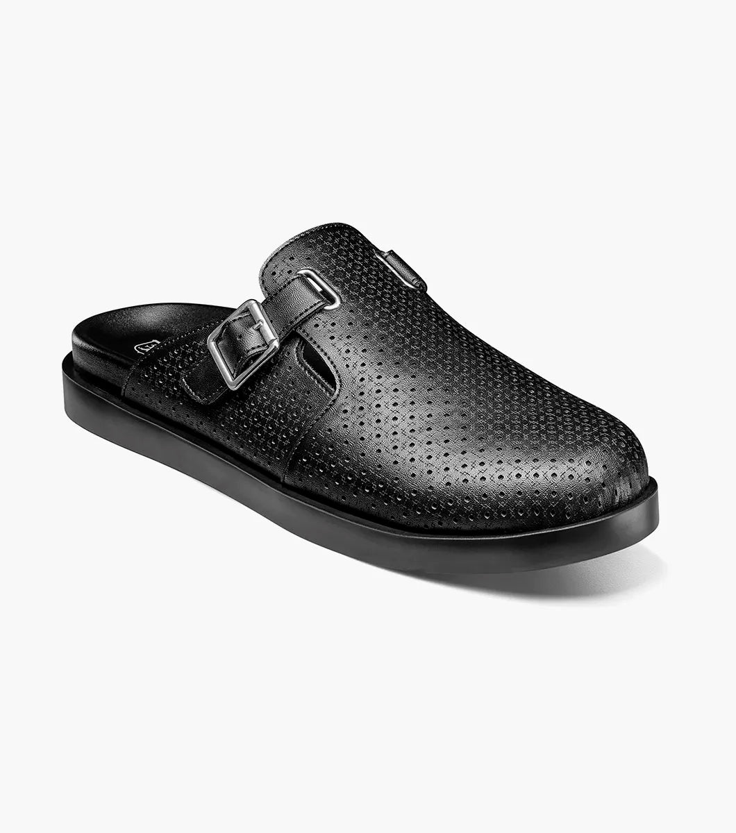 The Stacy Adams Montaine Strap Sandal in black (25696-001) features a perforated leather upper, leather linings, a side buckle, and a flat sole, displayed on a plain white background.