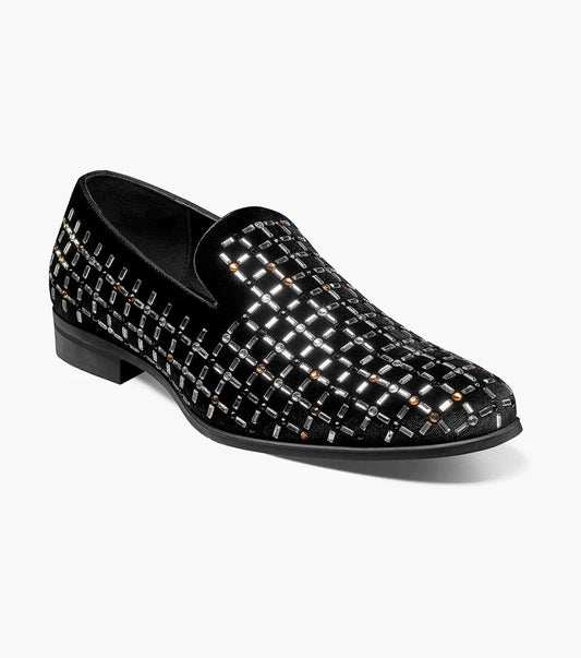 The Stacy Adams Stallford Rhinestone Slip On in Black Multi features a low heel, silver and gold grid-patterned studs, and anatomical arch support, blending dressy style with casual comfort.