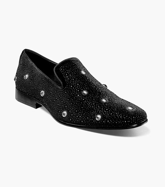 The Stacy Adams Spangle Rhinestone Slip On in black and silver features supple kidskin leather, low heel, plus sparkling rhinestones and round studs for added flair.