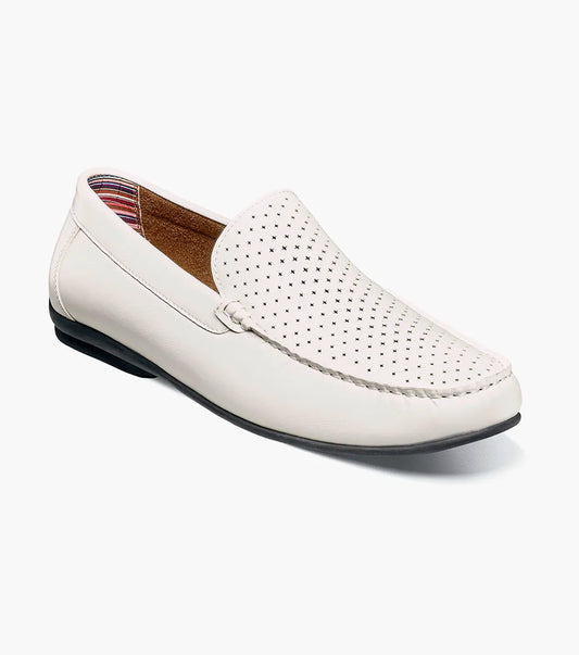The Stacy Adams Conroy Moc Toe Perf Slip On in white features a perforated leather upper, visible stitching, black rubber sole, and cushioned footbed for comfort. Shown in side profile on a plain background.