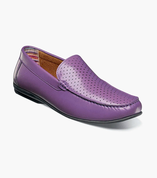 The STACY ADAMS Conroy Moc Toe Perf Slip On in purple (25702-542) features a perforated leather upper, cushioned footbed, black sole, and slip-on design, shown against a plain white background.