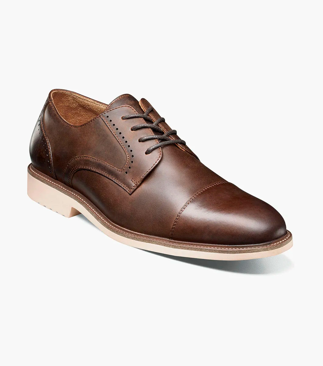 The STACY ADAMS Wesbridge Cap Toe Oxford (Brown CH, 25713-215) is a brown burnished leather dress shoe with a tan sole, anatomical arch support, and lace-up closure, shown against a white background.