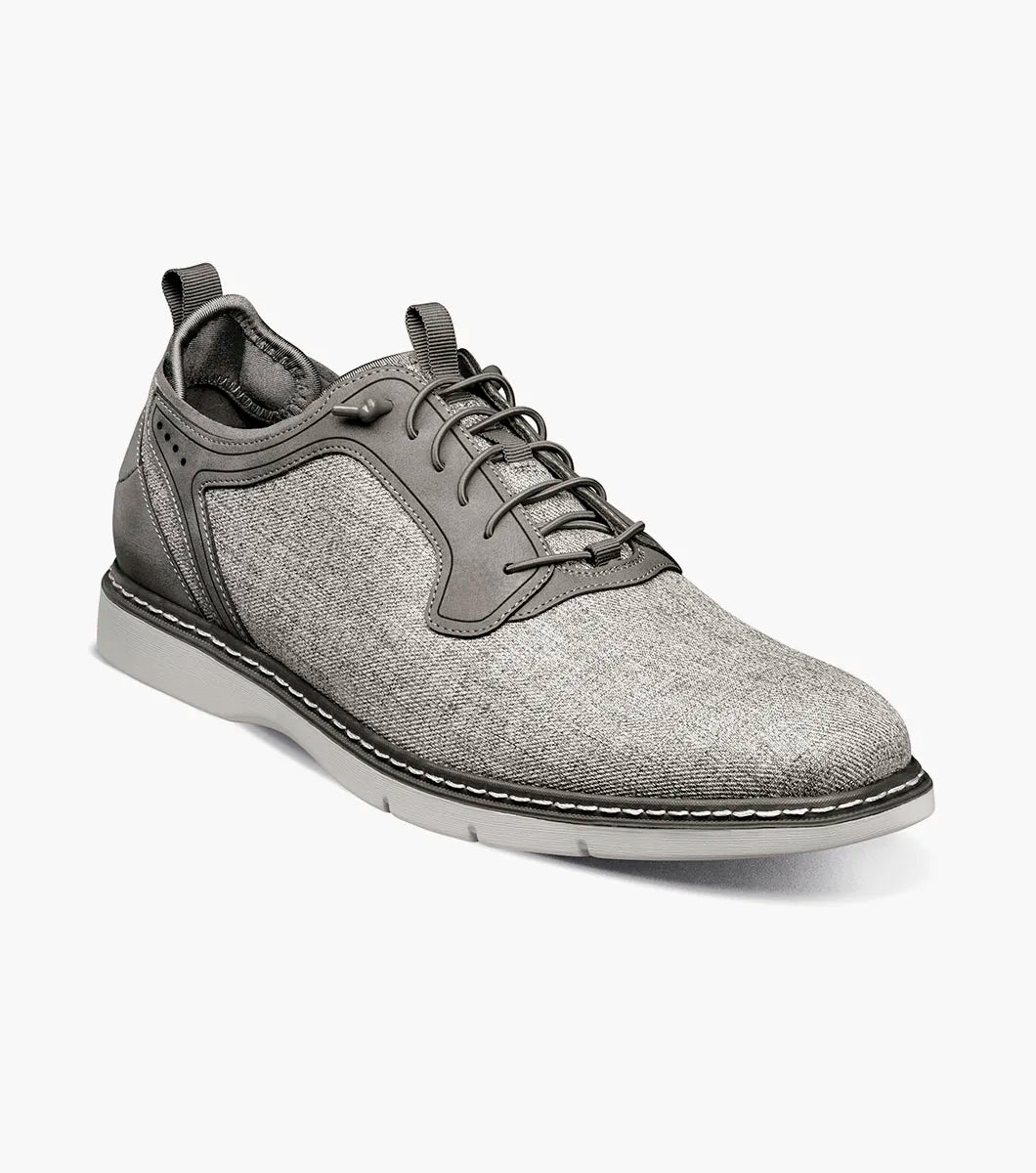 The Stacy Adams Scanlan Plain Toe Elastic Lace Up in Gray Multi features an elastic lace-up design, fabric upper, synthetic sole, and decorative stitching, showcased on a white background.