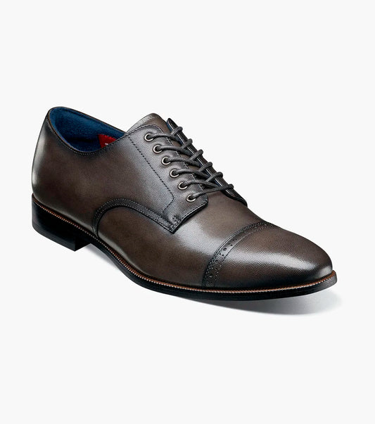 The STACY ADAMS William Cap Toe Oxford in gray (25719-020) features decorative stitching, a FlexZone footbed for comfort, and a durable rubber outsole. Shown in side profile on a white background.