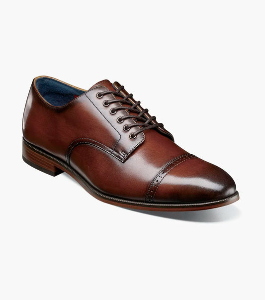 The Stacy Adams William Cap Toe Oxford in brown (25719-200) features decorative perforations and a FlexZone footbed for all-day comfort, shown side view on a white background.