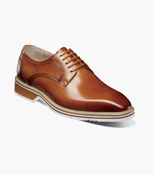 The STACY ADAMS "Barringer Plain Toe Oxford" in tan (25722-240) is a brown leather lace-up dress shoe with a low heel, white rubber sole, and Memory Foam footbed for comfort, shown against a plain white background.