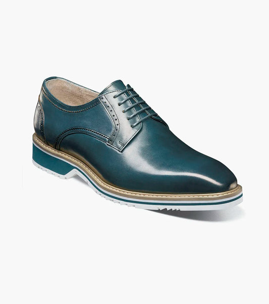 The Stacy Adams Barringer Plain Toe Oxford (Teal, 25722-444) features a rounded toe, tan welt, decorative stitching, leather upper, cushioned insole, and white rubber sole. Shown solo against a plain white background.