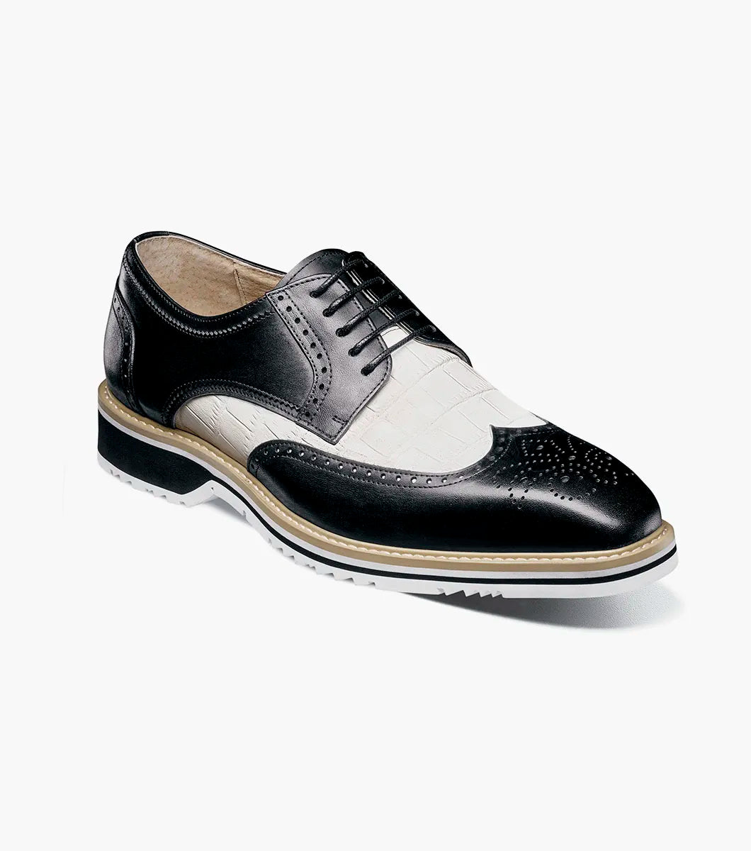The STACY ADAMS Beaumont Wingtip Oxford (Black w/White, 25723-111) features leather linings, decorative perforations, wingtip styling, and a contrasting sole, shown in side profile on a white background.