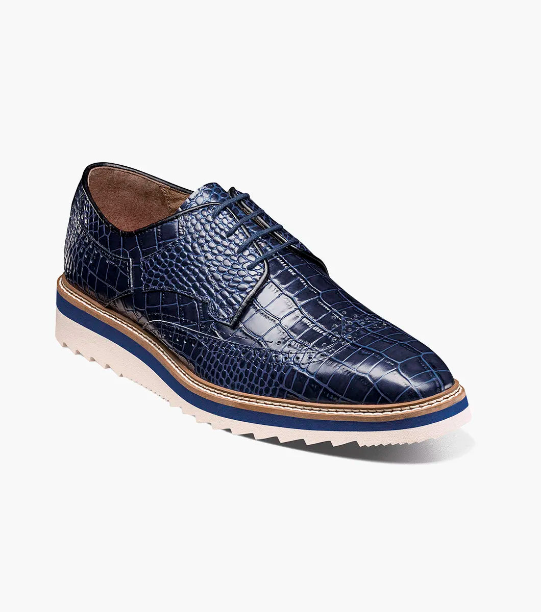 The Stacy Adams Alario Wingtip Oxford in Blue features a RedZone removable footbed with “Stacy Adams” labeling, molded heel cup, anatomical arch support, and cushioned heel pod for comfort in every step.