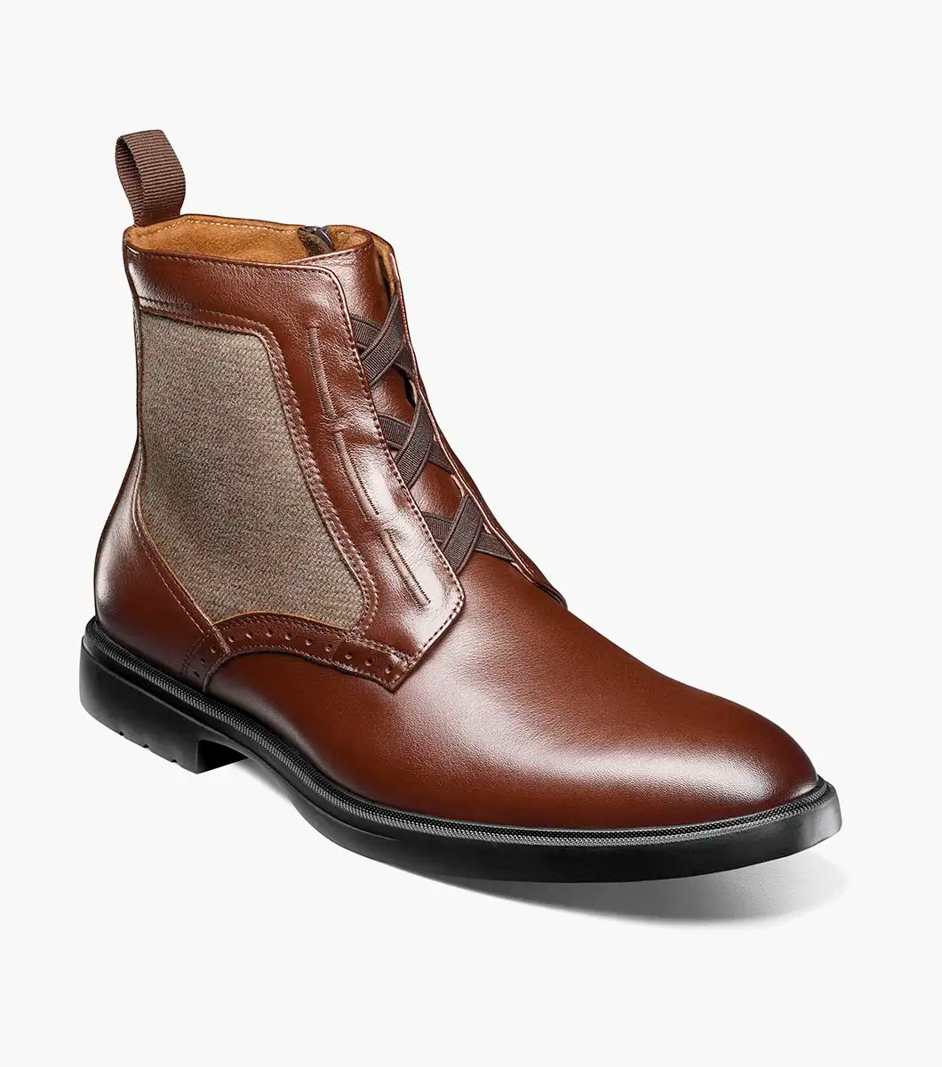 The STACY ADAMS Thompson Plain Toe Elastic Lace Boot in brown features leather and fabric, elastic side panels, a pull tab, black rubber sole, and comfortable RedZone footbed.