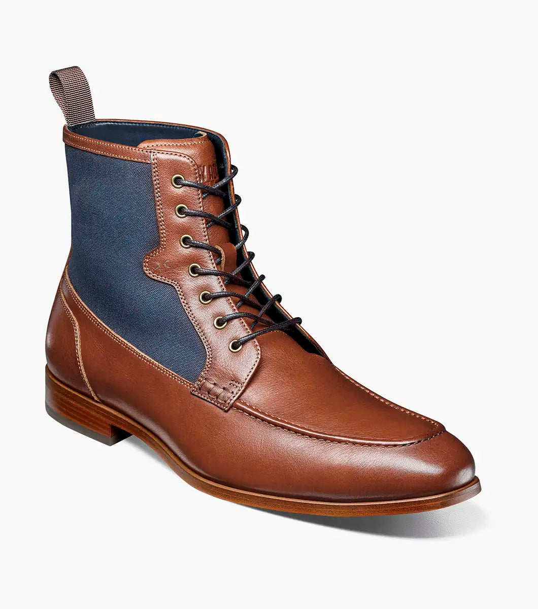 The STACY ADAMS Brumley Moc Toe Lace Up Boot in Tan Multi features burnished leather and navy fabric, a low wooden heel, cushioned footbed, and fabric pull tab.