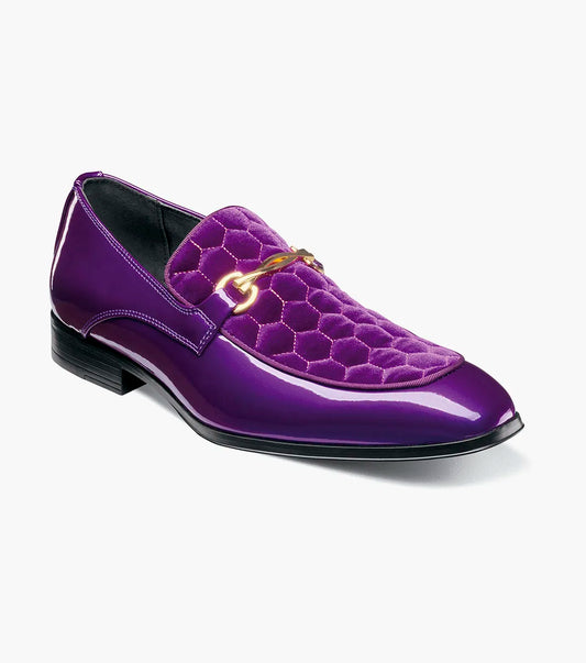 The STACY ADAMS Sprague Moc Toe Bit Slip On (25732-542) is a glossy purple loafer with a hexagonal quilted velvet upper, gold metal bit detail, and memory foam insole for comfort.