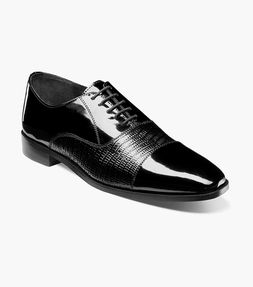 The Stacy Adams Razzeto Cap Toe Oxford in black features a patent leather lizard print, textured midsection, lace-up closure, and RedZone footbed for comfort, shown against a white background.