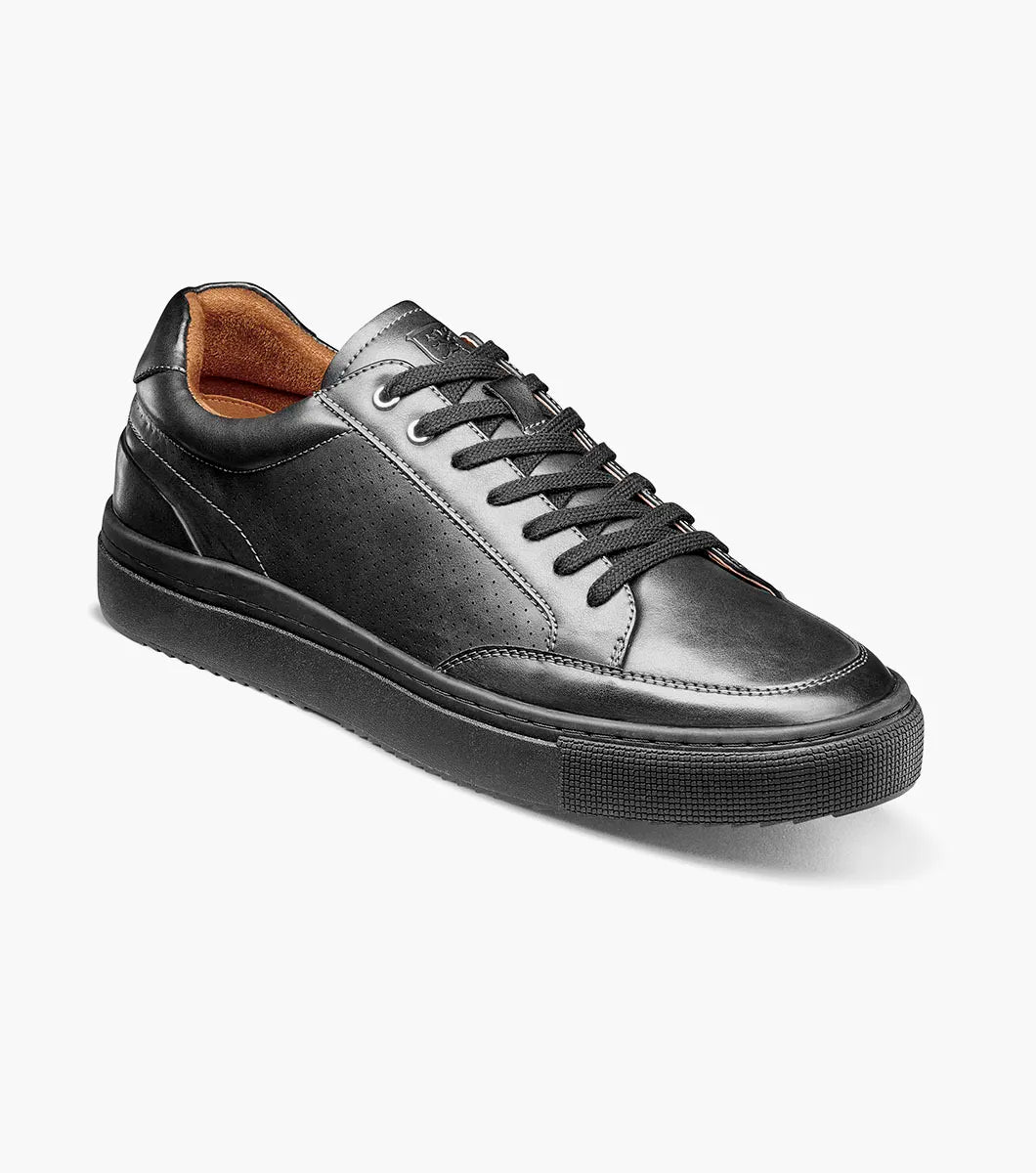 The STACY ADAMS Dorian Lace To Toe Sneaker (Black Smooth, style 25749-005) features a smooth black leather low-top design with black laces, a black rubber sole, and brown lining. It offers anatomical arch support and includes a RedZone removable footbed, shown against a plain white background.