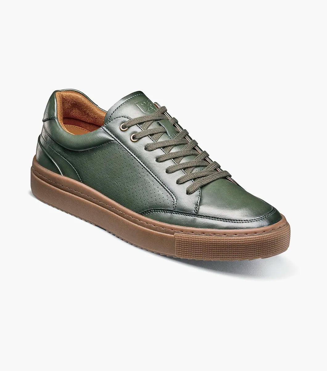 The Stacy Adams Dorian Lace To Toe Sneaker in green (style 25749-300) is displayed against a white background. This stylish STACY ADAMS shoe features matching green laces, a brown rubber sole, and anatomical arch support for enhanced comfort.