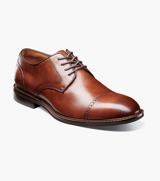 The STACY ADAMS Bailey Cap Toe Oxford in Brandy (25750-226) features brown leather, subtle stitching, and classic laced design—ideal men’s formal shoes displayed on a white background.